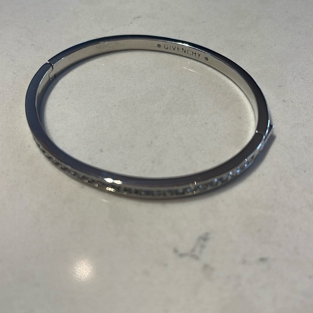 Brand new Givenchy silver bracelet with jewels in front and clasp on side